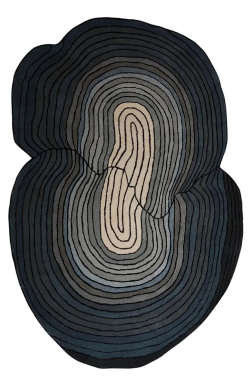 An abstract oval wall art piece with concentric organic lines in black, charcoal, gray, and cream, centered on a light off-white background with a soft drop shadow.