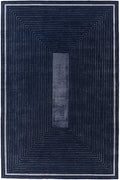 A rectangular area rug with a geometric design featuring concentric rectangular patterns and a central vertical stripe, in shades of navy blue and gray.