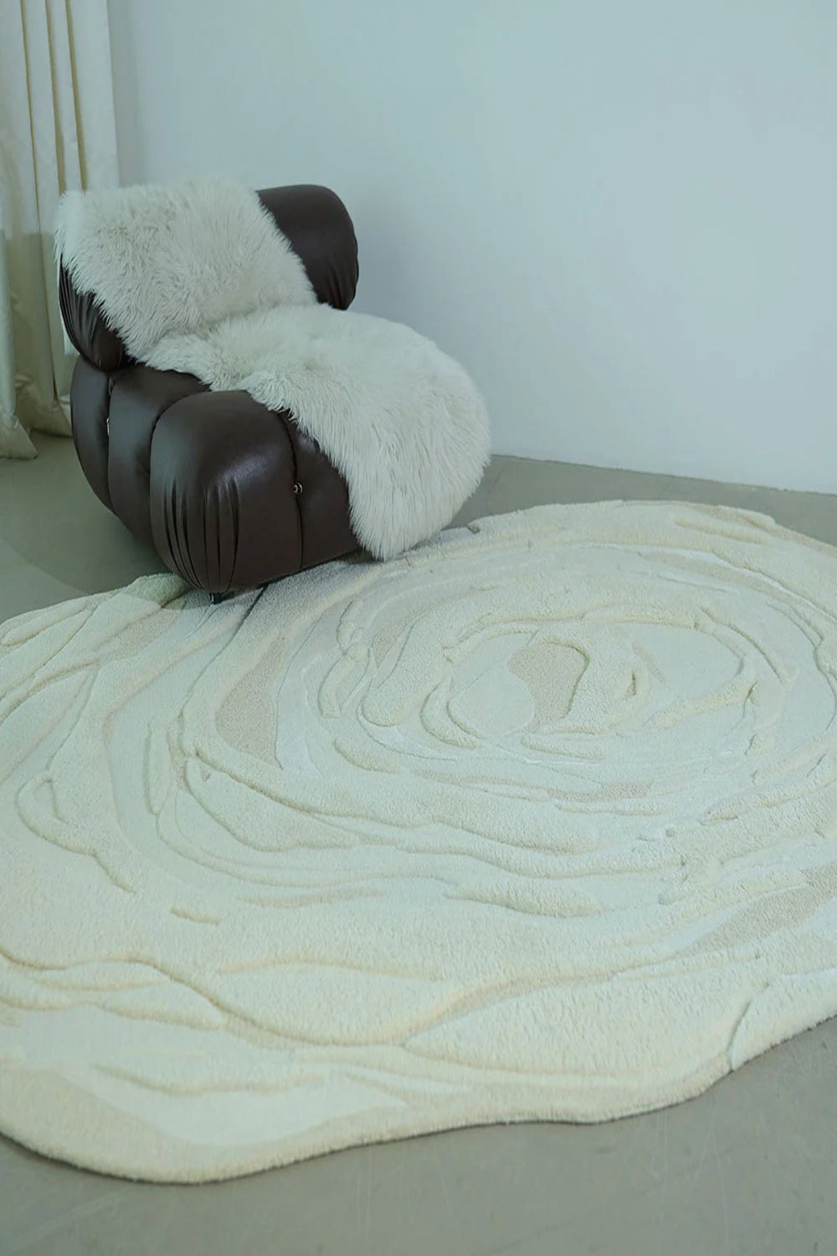 Brown leather chair with white fur cover on a beige carpet