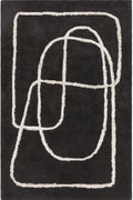 Black rug with white abstract patterns on a plain background