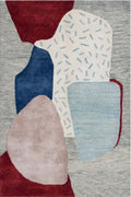 Abstract rug with geometric shapes in red, blue, beige, and white on a gray background