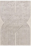 Textured area rug with wavy line pattern on a white background | kaleenvibe