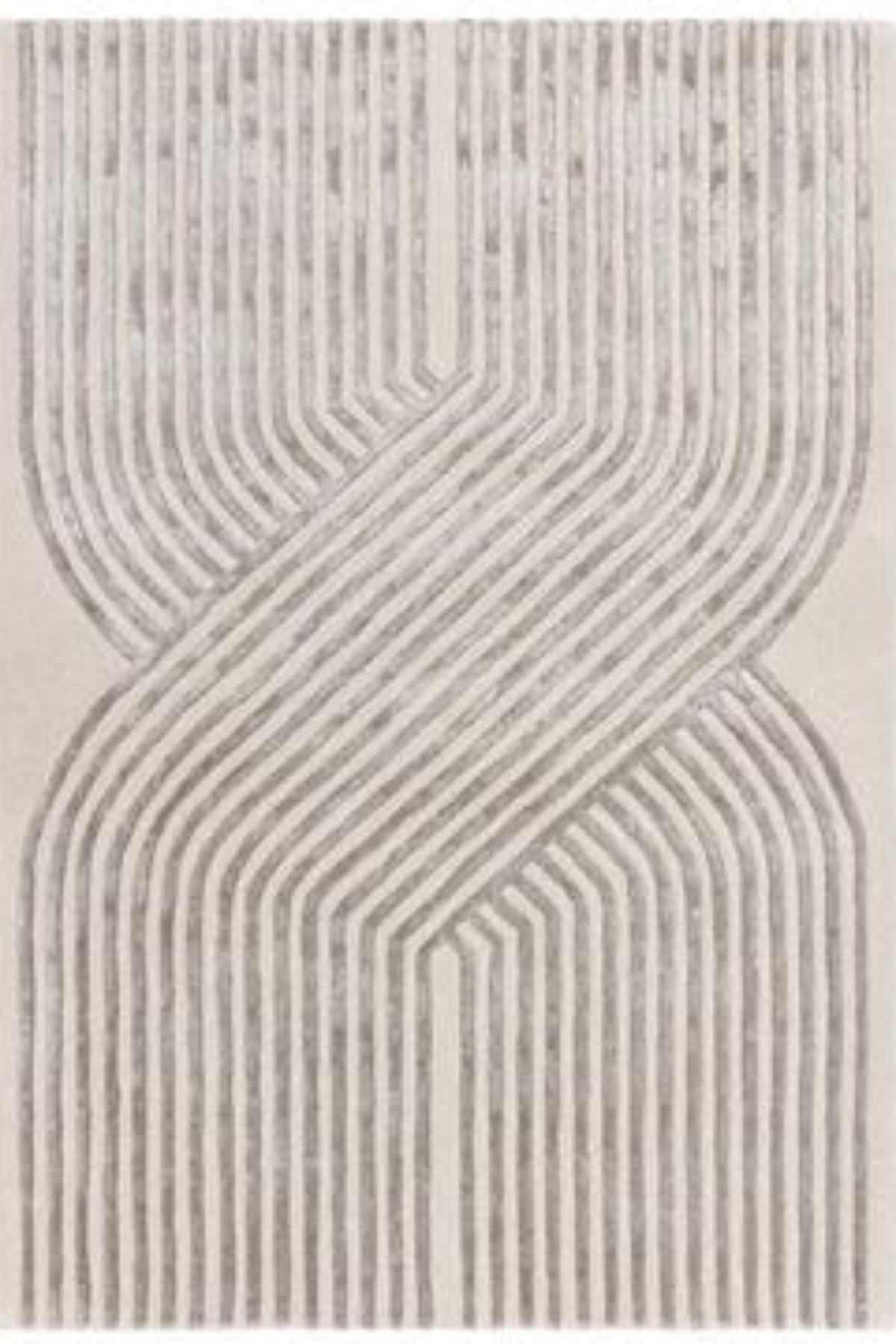 Textured area rug with wavy line pattern on a white background | kaleenvibe