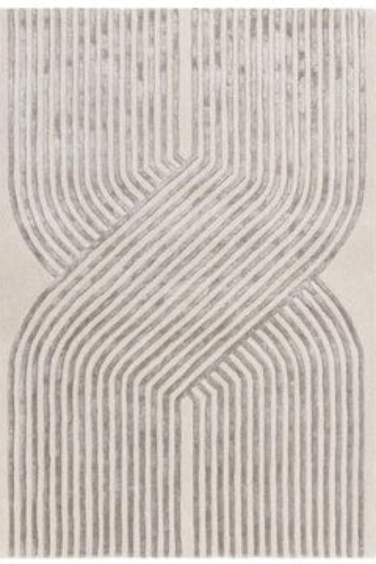Textured area rug with wavy line pattern on a white background | kaleenvibe
