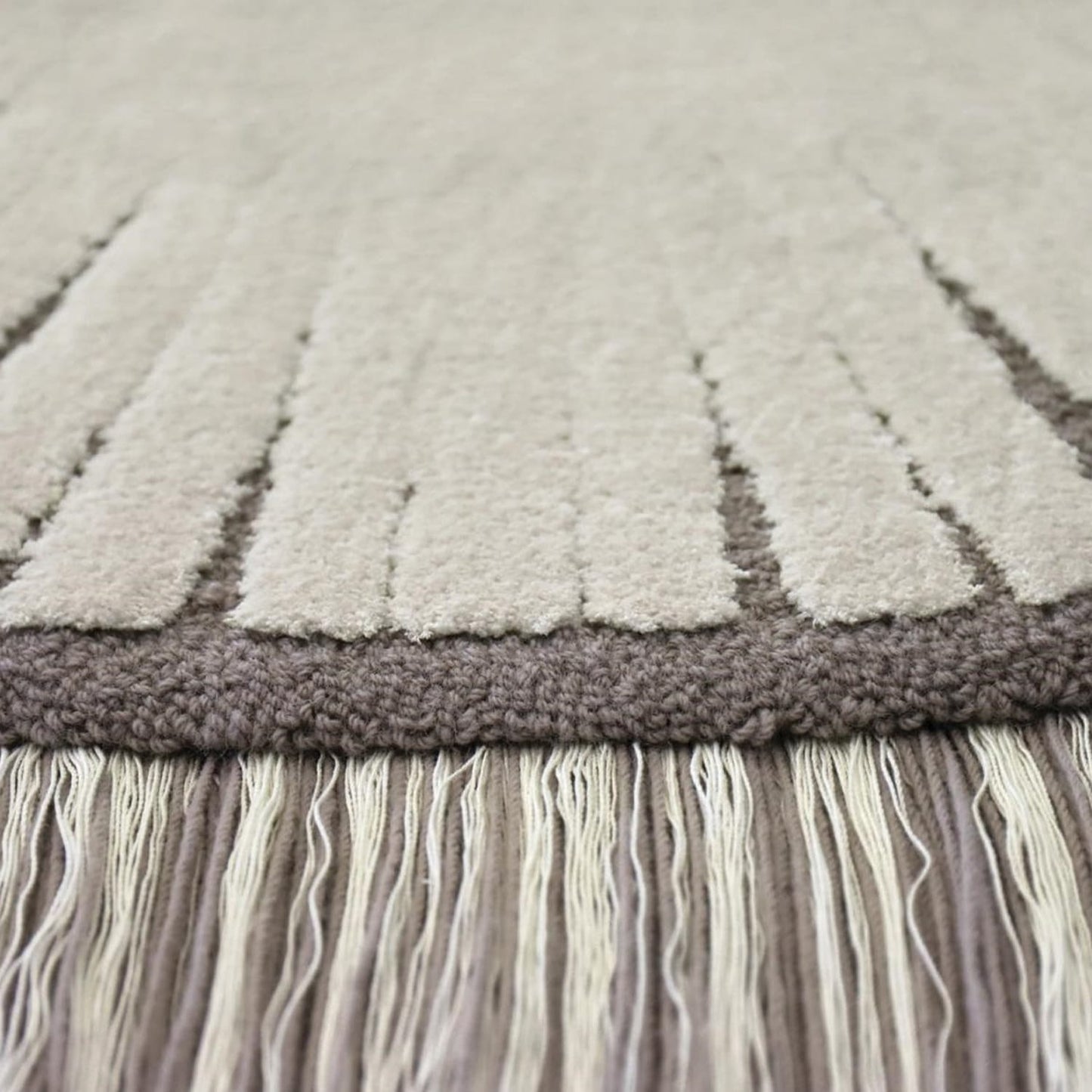 Close-up of premium hand-tufted texture and intricate Pulse pattern