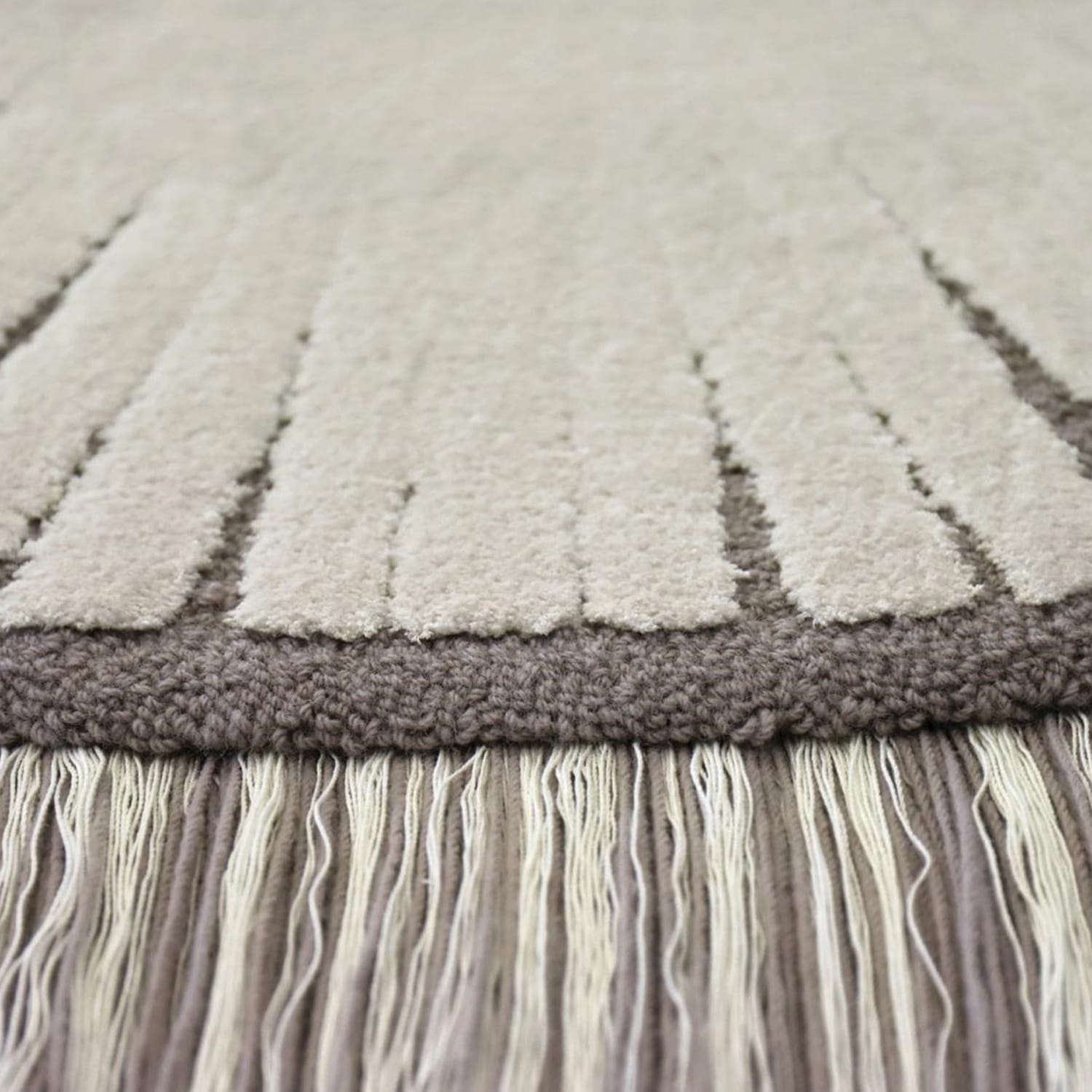 Close-up of premium hand-tufted texture and intricate Pulse pattern