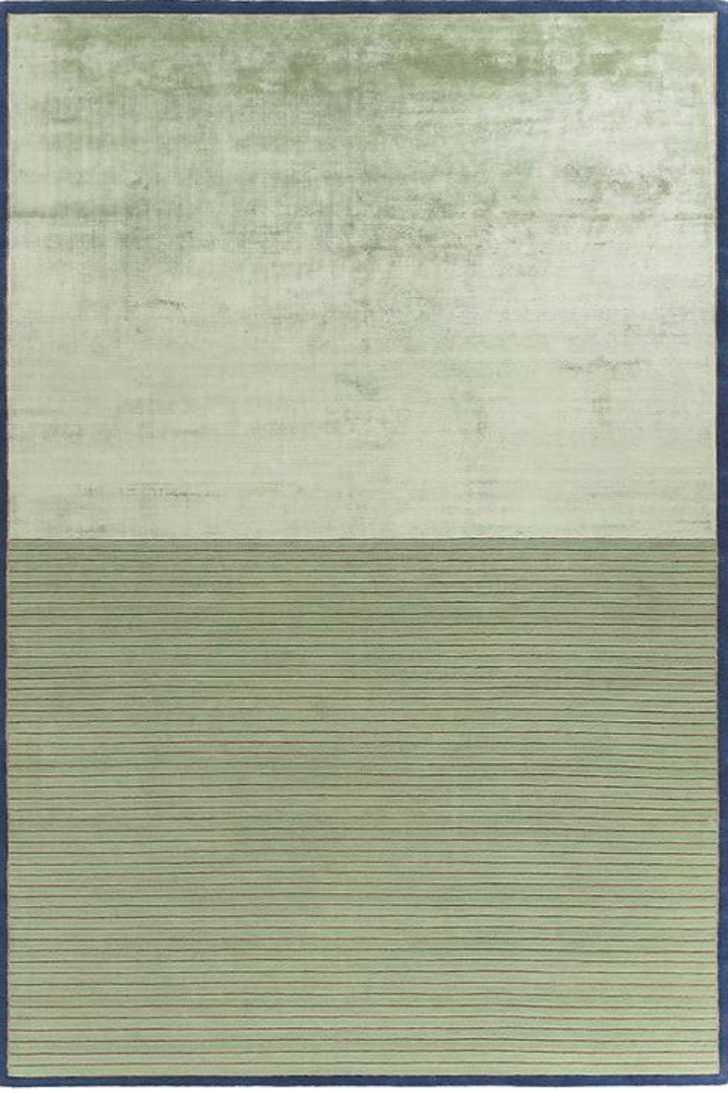A rectangular area rug with a two-tone design, featuring a textured light sage green upper half and a ribbed olive green lower half, finished with a dark blue border.