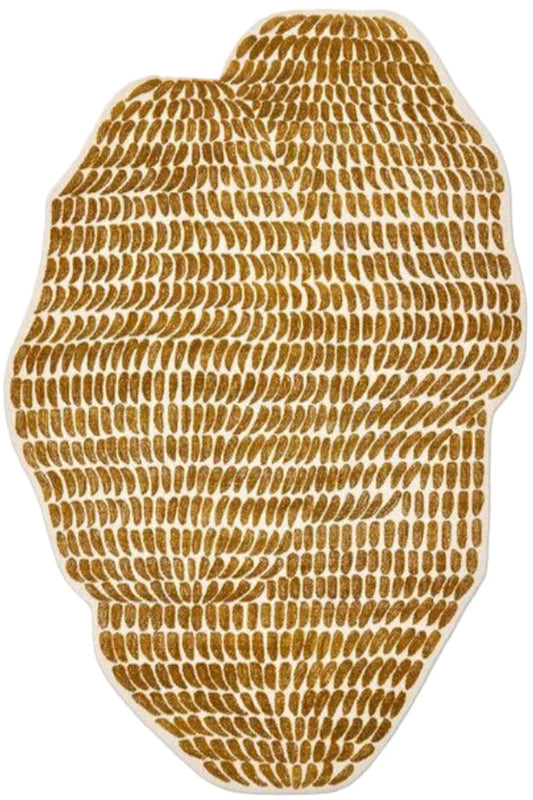 Gold textured rug on a white background | Unshaped rug | Kaleen Vibe 
