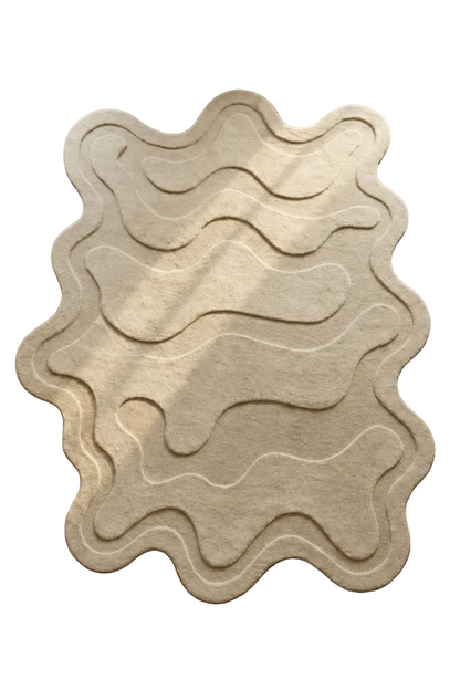Wavy patterned rug on a wooden floor