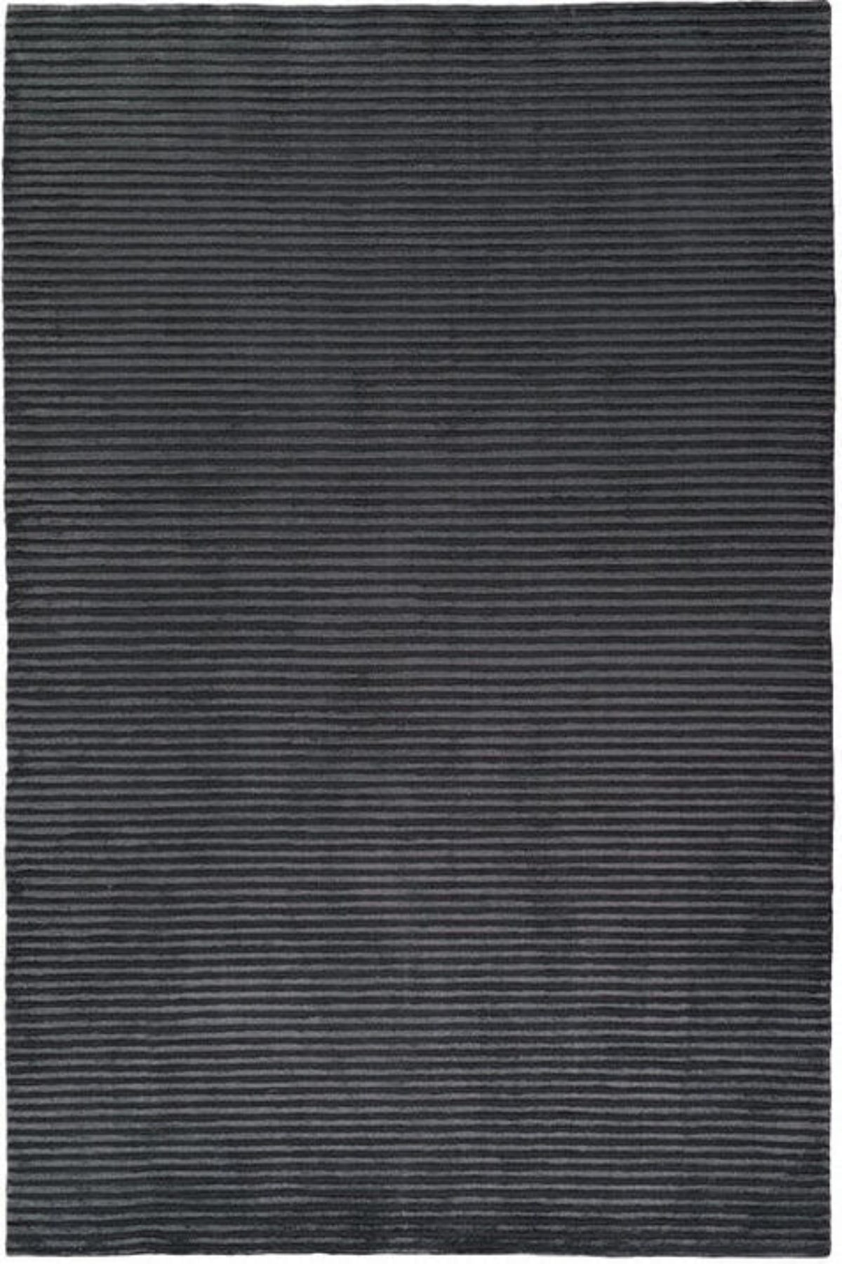 A dark charcoal gray area rug with a textured, horizontally ribbed pattern filling the entire frame.