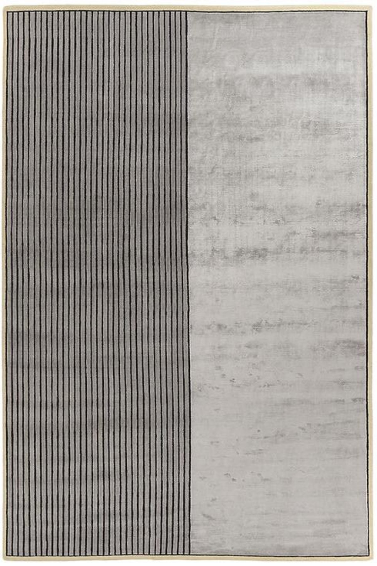 A rectangular area rug with a modern minimalist design, featuring a vertical split with a left panel of thin dark vertical stripes on a light gray background and a right panel of mottled light gray texture.